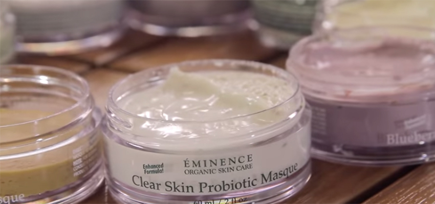 An assortment of Eminence Organic Skin Care masques with lids removed